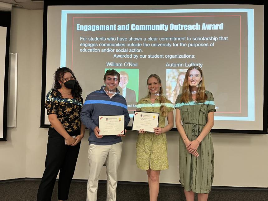 William O'Neil (center left) and Autumn Lafferty (center right) receive the inaugural Engagement and Community Outreach (ECO) Award