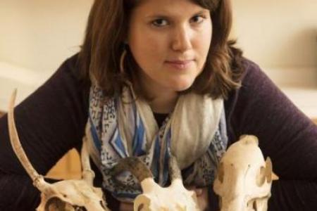 Dr. Birch poses with animal skulls 